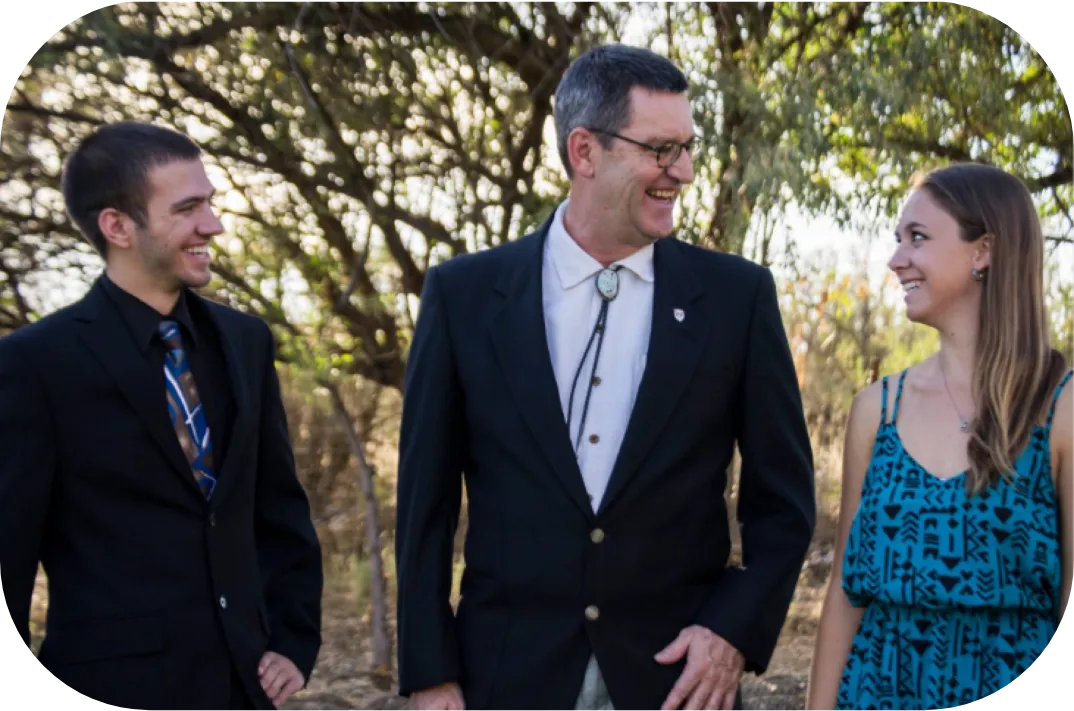 The Avalore founders in college, laughing outdoors with a mentor